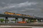 A UP MIXED FREIGHT PULLS ACROSS THE JUNCTION